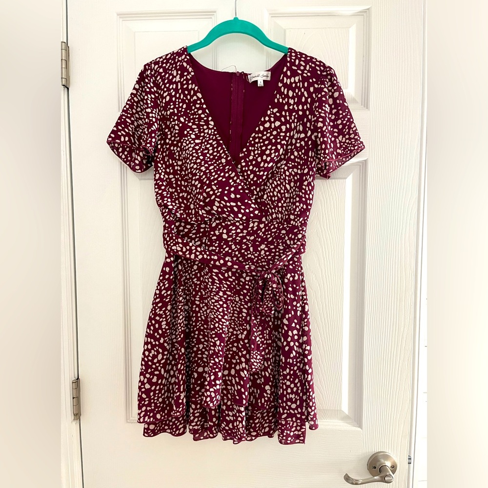 Maroon and white polka dot dress, v-neck and zip up in the back, tie on waist